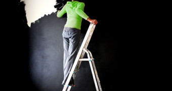 woman-painting-wall-black
